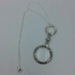 Silver magnifying glass on chain