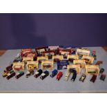 Large qty of boxed & unboxed die cast cars & commercial vehicles