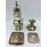 Mappin & Webb sterling silver sugar shaker, single silver candlestick, silver cigarette cases &