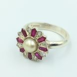 Diamond & synthetic ruby target ring centrally set with single split pearl, possibly re-shanked on a