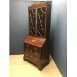 Mahogany & shell inlaid bureau bookcase with arched pediment above astragal glazed doors above the