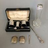 Pair of 3 branch candelabras, white metal Vesta cases, button hooks. Cased silver condiment set,