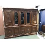 Very large & heavily carved contemporary Italian style wall unit, with 5 carved cupboards below a