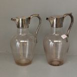 Pair of silver mounted glass claret jugs