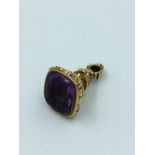 Early Victorian amethyst & unmarked yellow metal fob seal, amethyst plaque bearing coat of arms (
