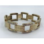 Yellow gold Cartier style bracelet set with diamonds