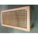 Contemporary coffee table with wooden lattice pattern beneath a glass top (v small chip in glass