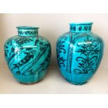 Pair of C17th blue earthware jars, 1 decorated with fish the other with plants 30hx24dia cm