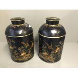 Pair of black tin canisters decorated with a floral scene & birds 38Hx23dia cm