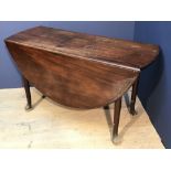 Mahogany drop leaf table on castors 71Hx122Wx142L cm