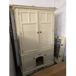 Contemporary housekeeper's kitchen cupboard, with doors opening to reveal fitted interior, painted
