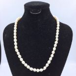Pearl necklace with heart shaped clasp