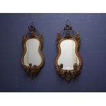 Pair of Victorian wall mirrors with ornate carved & gilt frame, flanked each side with candle