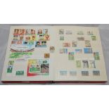 Stamps and first day covers. Large red stamp album comprising a good selection of cricket stamps and