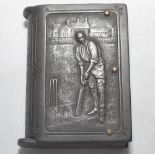 Vesta case. Unusual Victorian bakerlite brown vesta case, modelled as a book, depicting a batsman,