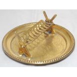 Brass ashtray set with two pairs of crossed bats supporting a lattice cradle on circular metal