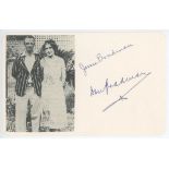 Don Bradman. White card with a photograph cutting of Bradman standing with his wife, Jessie.