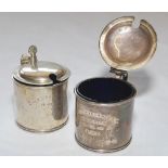 A pair of silver hallmarked circular mustard pots with hinged lids and both retaining original