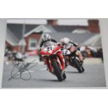 Motorsport. John McGuinness. Large colour photograph of McGuinness in race action, nicely signed