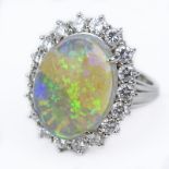 Vintage Oval Cabochon Opal, Diamond and Platinum Ring. Opal measures 16mm x 12mm, with good play