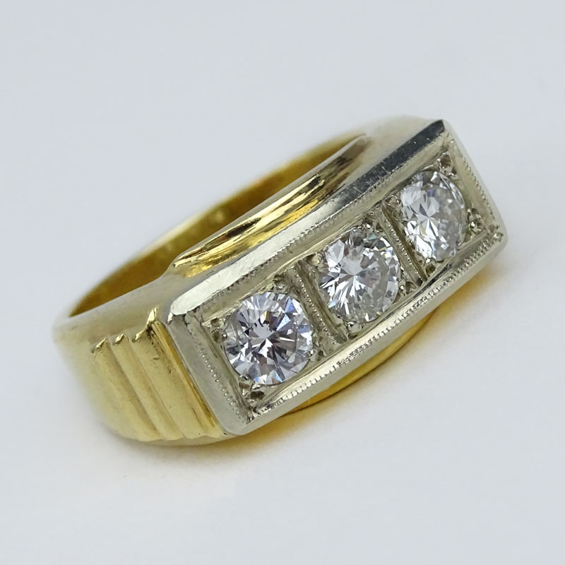 Men's Vintage Round Brilliant Cut Diamond and 14 Karat Yellow Gold Three Stone Ring. Stamped 14K.