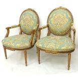 Pair of Karges Carved Parcel Gilt Wood Upholstered Louis XIV Style Fauteuils. Manufactured by Karges