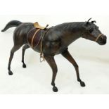 Large Vintage Leather Wrapped Model of a Horse. Normal rubbing to surface, junction to tail or