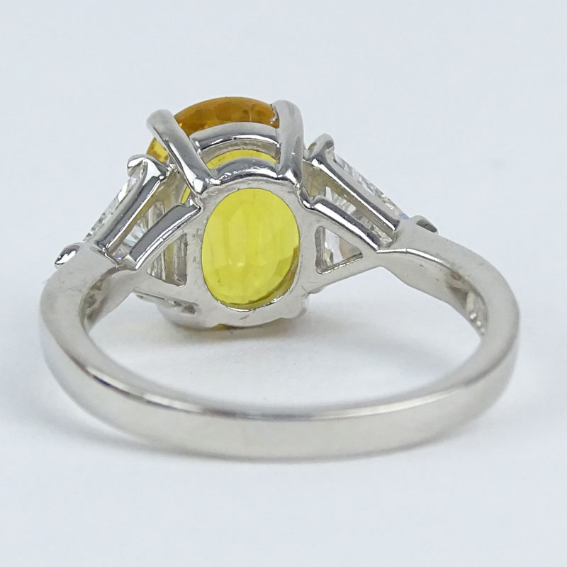 Approx. 4.33 Carat Oval Cut Yellow Sapphire, .78 Carat Trillion Cut Diamond and Platinum Ring. - Image 2 of 4
