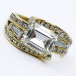 Approx. 3.0 Carat Emerald Cut Diamond and 14 Karat Yellow Gold Ring accented throughout with
