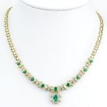 Vintage Approx. 2.20 Carat Baguette and Round Brilliant Cut Diamond, Oval Cut Emerald and 14 Karat
