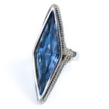 London Blue Topaz and 14 Karat White Gold Ring. Topaz measures 26mm x 7.5mm. Unsigned. Very good