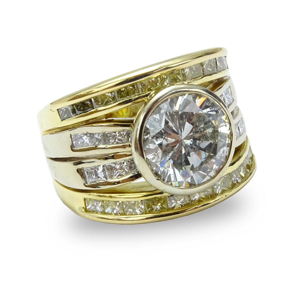 Contemporary Approx. 5.20 Carat TW White and Yellow Diamond and 18 Karat Yellow Gold Ring. Set in