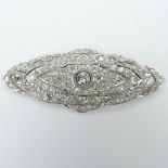 Art Deco Approx. 10.0 Carat Old Mine Cut Diamond and Platinum Brooch. Diamonds E-F color, SI1-SI2