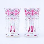 Pair of Bohemian Cut to Cranberry Lusters with Hanging Prisms. A few prisms appear to have nicks,