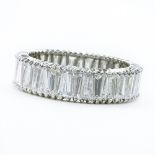 Approx. 4.0 Carat Tapered Baguette Diamond and Platinum Eternity Band. Diamonds G color, VS clarity.