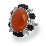 Cabochon Red Coral, Diamond, Onyx and 18 Karat White Gold Ring. Coral measures 19mm x 13.5mm.