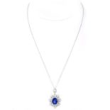 Approx. 5.56 Carat Oval Cut Sapphire, 2.28 Carat Baguette and Round Brilliant Cut Diamond and 18 Ka