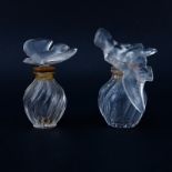 Two (2) Lalique for Nina Ricci L'air du Temps Perfume Bottles. Each signed appropriately. One stopp