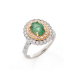 Oval Cut Emerald, Round Brilliant Cut Yellow and White Diamond and 14 Karat White Gold Ring. Emeral