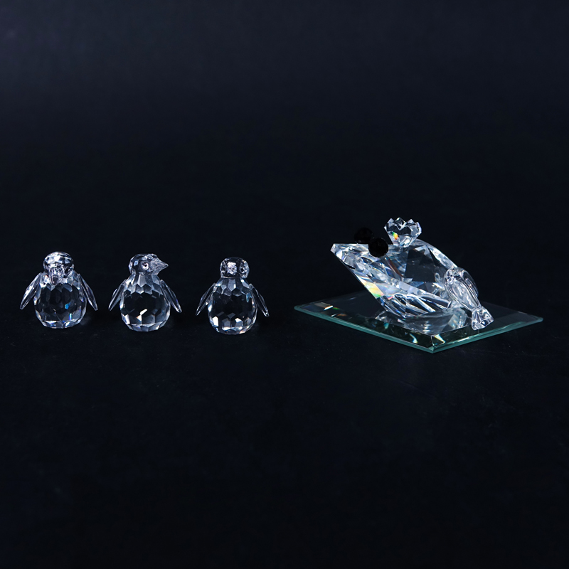 Four (4) Swarovski Crystal Animal Figurine in Original Boxes. Includes: Four miniature penguins 1-5