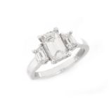 Approx. 2.33 Carat TW Diamond and Platinum Engagement Ring. Set in the center with 1.58 Carat Emer