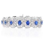 Approx. 11.70 Carat Oval Cut Sapphire, 2.95 Carat Round Brilliant Cut Diamond and 18 Karat White Go