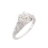 Approx. 1.37 Carat TW Diamond and Platinum Engagement Ring. Set in the center with a 1.12 carat old