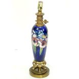 A Moorcroft Iris Pottery Vase Mounted as Lamp. Good condition. Overall measures 21-1/2" H. Shipping