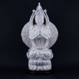 Large Chinese Blanc de Chine Guanyin with a Thousand Arms On Wooden Base. Stamped on obverse side.