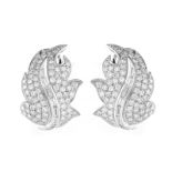 Approx. 4.25 Carat Pave Set Round Brilliant Cut Diamond. Baguette Cut Diamond and Platinum Leaf Ear