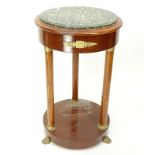 20th Century Empire Style Round Marble Top Table. Gilt brass mounted with four columns and stands o