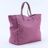 Gucci Pink Canvas Monogram Canvas Guccissima Tote. Brown leather straps. Natural canvas interior wi