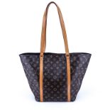 Louis Vuitton Brown Monogram Coated Canvas Sac Shopping PM Tote. Golden brass hardware. Interior of