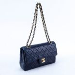 Chanel Navy Blue Quilted Leather Classic Double Flap Bag 23. Gold tone hardware, interior of burgun